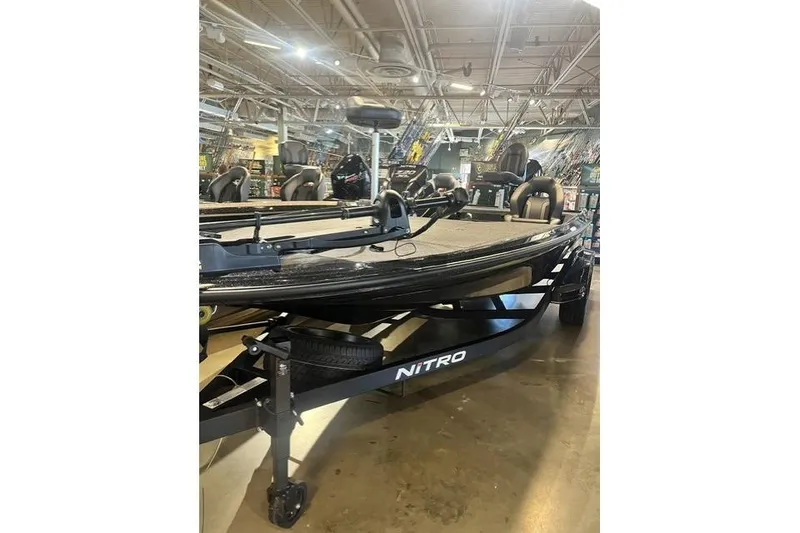 Slide: The Image of 2026 Nitra Boats Z20XL on display in a showroom, featuring sleek design and modern equipment. - 5
