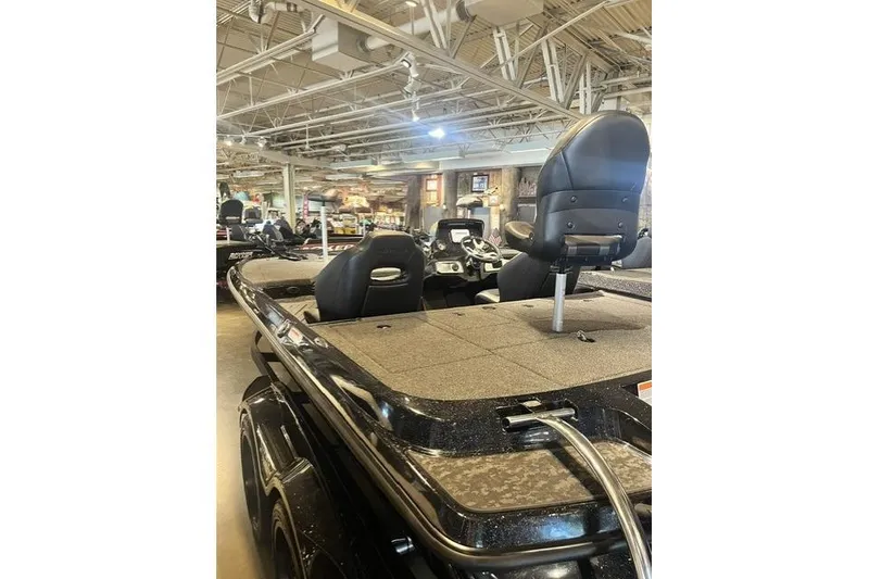 Slide: The Image of 2026 Nitra Boats Z20XL in showroom, featuring sleek design and comfortable seating. - 4