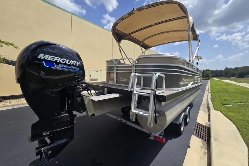 Slide: The Image of 2021 Sun Tracker Party Barge 24 DLX with Mercury SeaPro engine on trailer. - 4