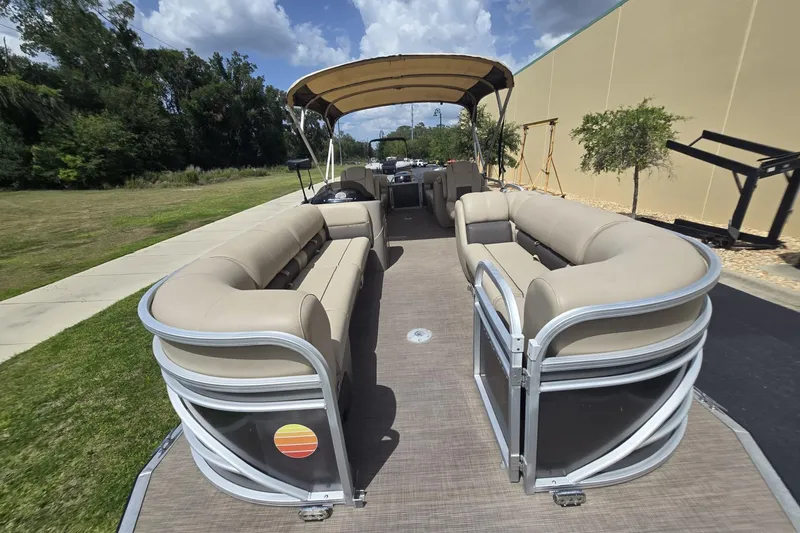 Slide: The Image of 2021 Sun Tracker Party Barge 24 DLX pontoon boat with beige seating and canopy. - 6