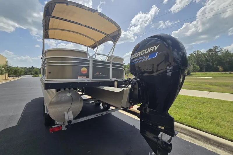 Slide: The Image of 2021 Sun Tracker Party Barge 24 DLX with Mercury engine on a trailer. - 5