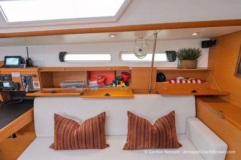 Slide: The Image of Interior of 2015 Jeanneau Sun Odyssey 439 yacht with cozy seating and storage compartments. - 43