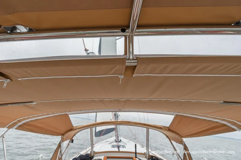 Slide: The Image of 2015 Jeanneau Sun Odyssey 439 sailboat cockpit with tan canvas bimini top. - 37