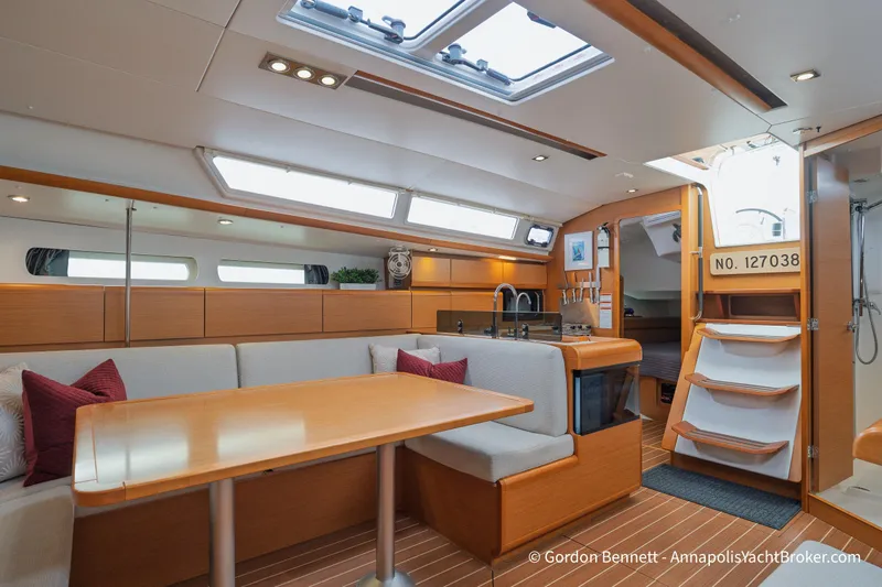 Slide: The Image of Interior of 2015 Jeanneau Sun Odyssey 439 yacht with modern dining area and kitchen. - 41