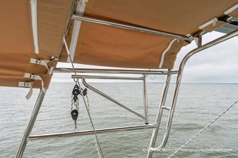Slide: The Image of Jeanneau Sun Odyssey 439 (2015) sailboat canopy and rigging over calm sea. - 27