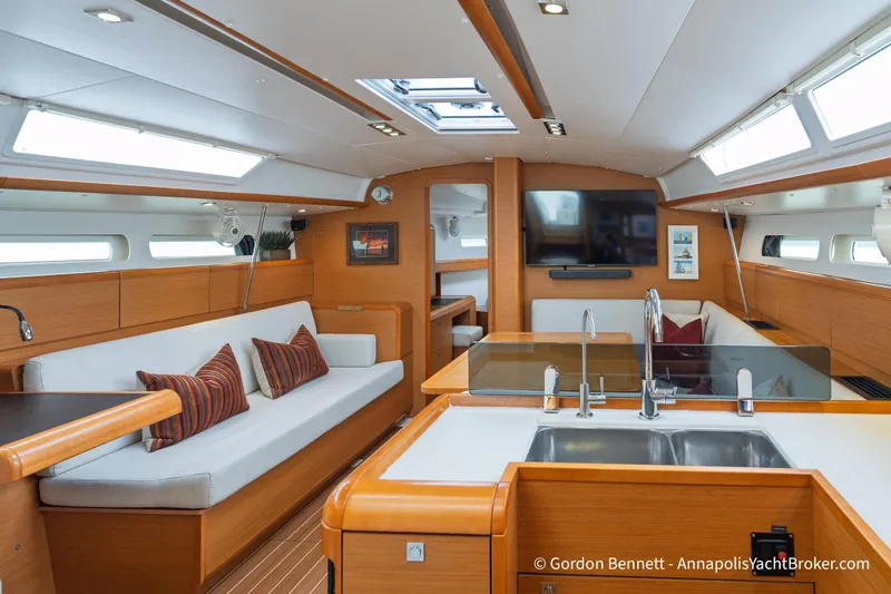 Slide: The Image of Interior of 2015 Jeanneau Sun Odyssey 439 yacht with modern kitchen and seating area. - 39