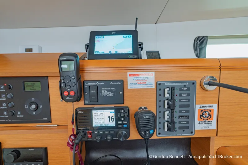 Slide: The Image of Control panel of a 2015 Jeanneau Sun Odyssey 439 yacht with navigation and communication equipment. - 57