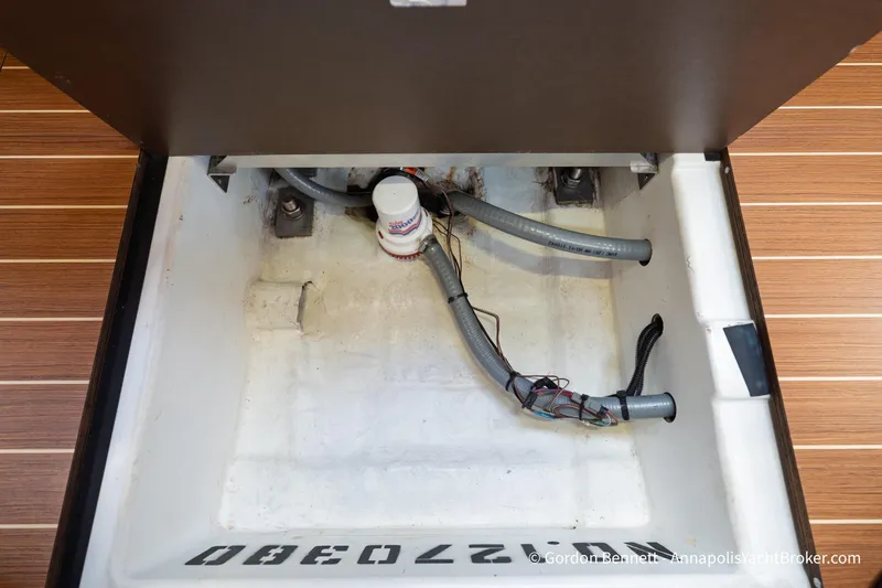 Slide: The Image of Bilge compartment of 2015 Jeanneau Sun Odyssey 439 yacht with visible wiring and hoses. - 64