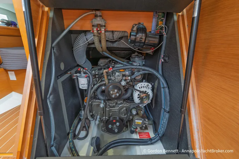 Slide: The Image of Engine compartment of 2015 Jeanneau Sun Odyssey 439 sailboat, showcasing detailed mechanical components. - 59