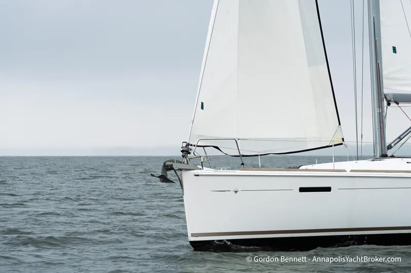 Slide: The Image of 2015 Jeanneau Sun Odyssey 439 sailing on calm waters under overcast skies. - 11