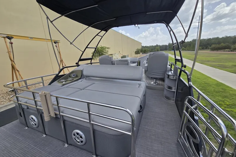 Slide: The Image of 2019 Regency 230 LE3 Sport pontoon boat with spacious seating and canopy. - 9