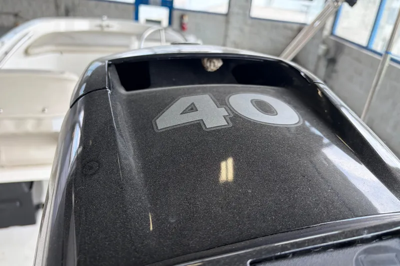 Slide: The Image of Close-up of a 2024 Boston Whaler 130 Super Sport engine with "40" marking. - 20