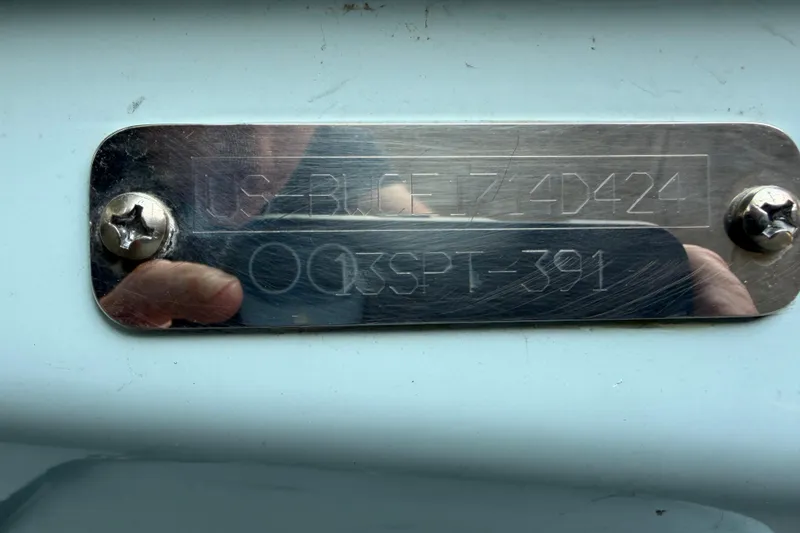 Slide: The Image of 2024 Boston Whaler 130 Super Sport hull identification plate with engraved serial number. - 29