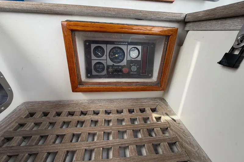 Slide: The Image of Control panel of a 1989 Tayana Vancouver 42 sailboat with wooden trim. - 19