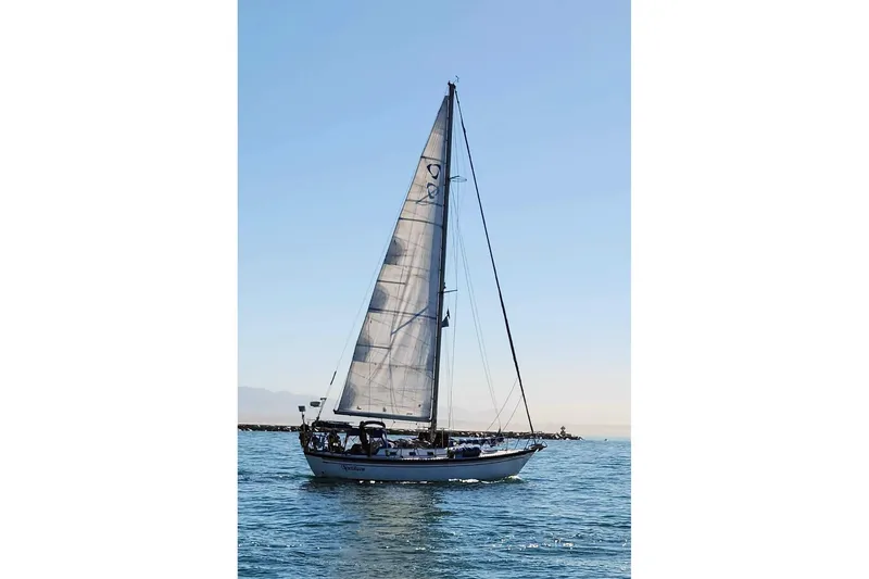 Slide: The Image of Sailing yacht Tayana Vancouver 42, 1989 model, gliding on calm waters under clear skies. - 36