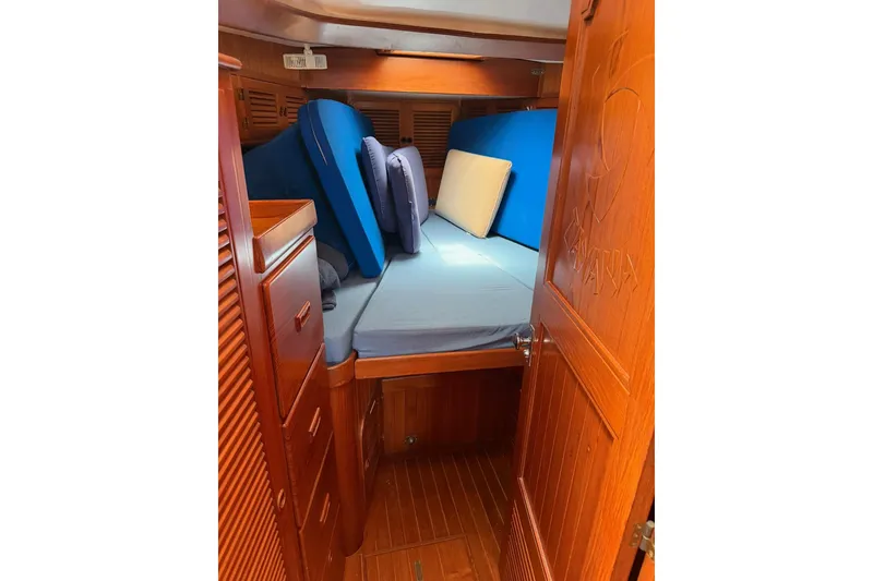 Slide: The Image of Cozy cabin interior of 1989 Tayana Vancouver 42 sailboat with wooden finish and cushions. - 27