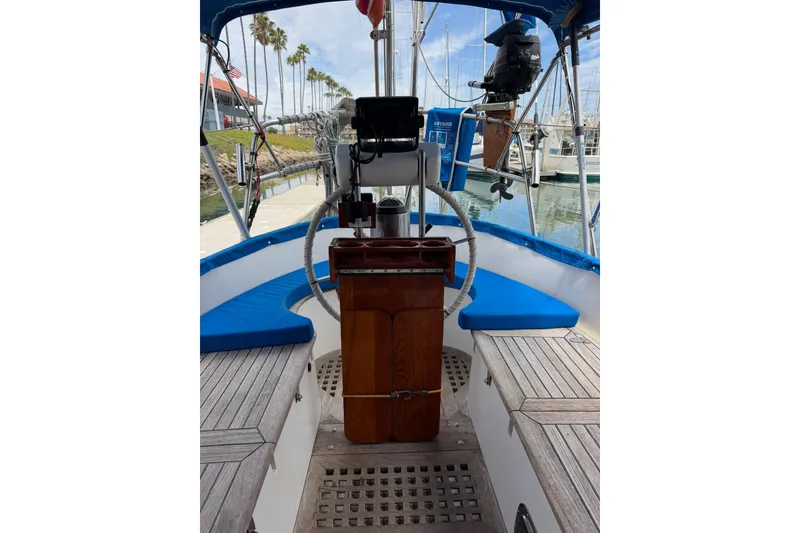 Slide: The Image of Cockpit of 1989 Tayana Vancouver 42 sailboat with blue cushions and wooden accents. - 17