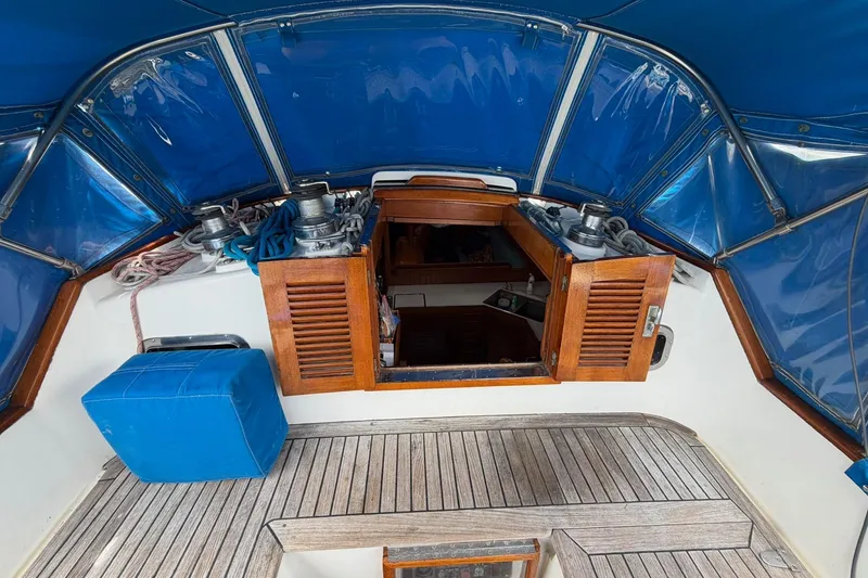 Slide: The Image of Cockpit of 1989 Tayana Vancouver 42 sailboat with blue canopy and wooden hatch. - 20