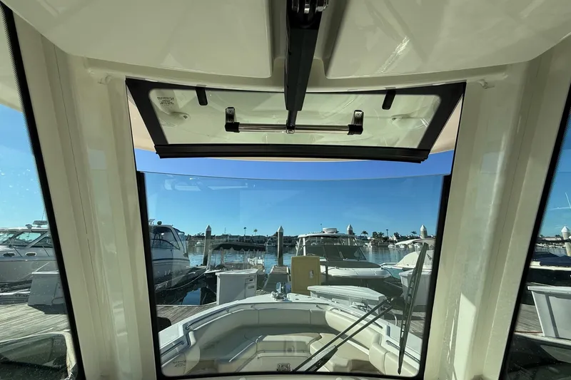 Slide: The Image of 2025 Boston Whaler 250 Outrage boat interior view at marina. - 30