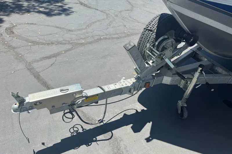 Slide: The Image of Trailer hitch and winch of a 2008 Duckworth Navigator Sport 195 boat on pavement. - 7
