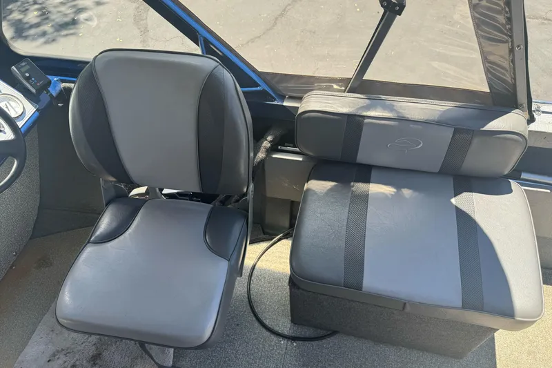 Slide: The Image of Interior seating of a 2008 Duckworth Navigator Sport 195 boat, featuring gray and black upholstery. - 15
