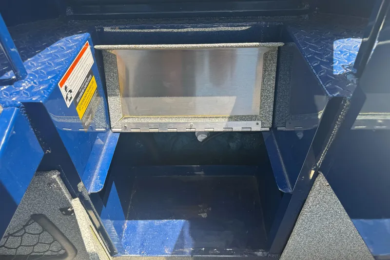 Slide: The Image of Storage compartment of a 2008 Duckworth Navigator Sport 195 boat, featuring a blue interior. - 19