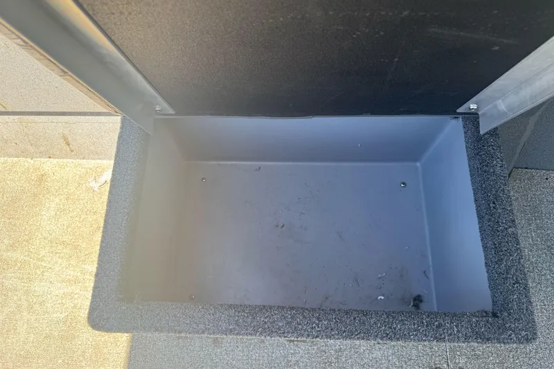 Slide: The Image of Storage compartment of a 2008 Duckworth Navigator Sport 195 boat, open and empty. - 22