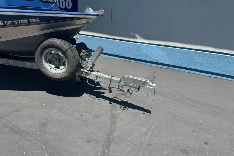 Slide: The Image of Trailer hitch of a 2008 Duckworth Navigator Sport 195 boat parked on pavement. - 8
