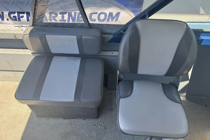 Slide: The Image of Interior seating of a 2008 Duckworth Navigator Sport 195 boat, featuring gray upholstery. - 21