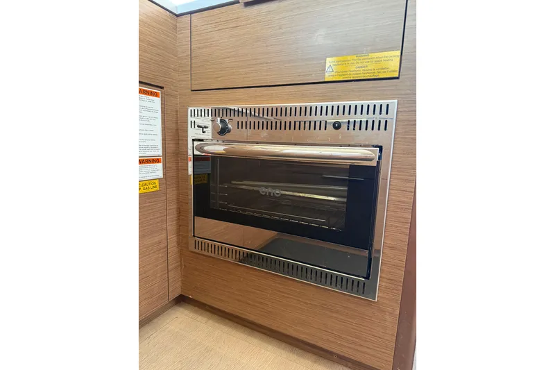 Slide: The Image of Built-in oven on Lagoon 46 yacht, 2021 model, with wood paneling. - 50