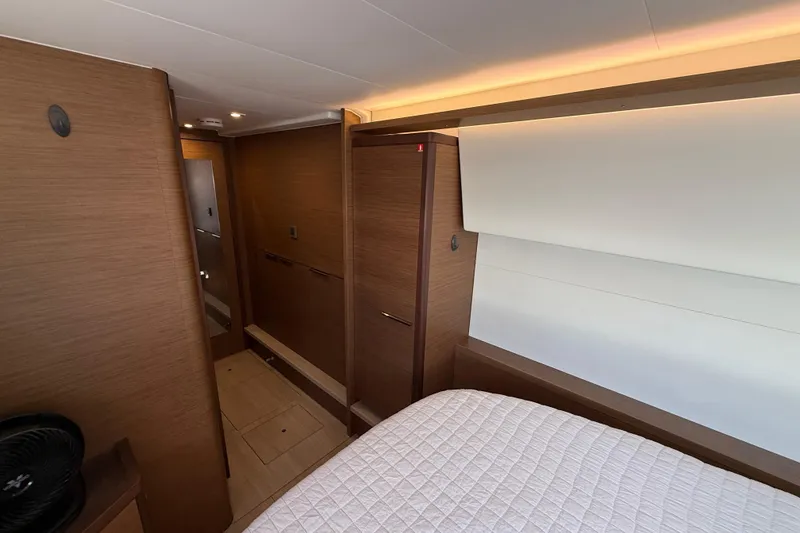 Slide: The Image of Interior of 2021 Lagoon 46 yacht cabin with modern wood finish and cozy bedding. - 85