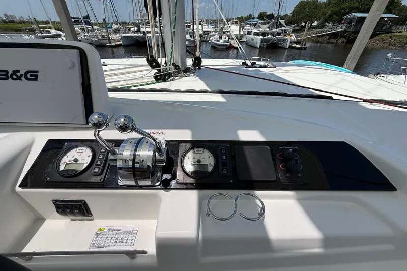 Slide: The Image of Control panel of a 2021 Lagoon 46 catamaran at a marina. - 17