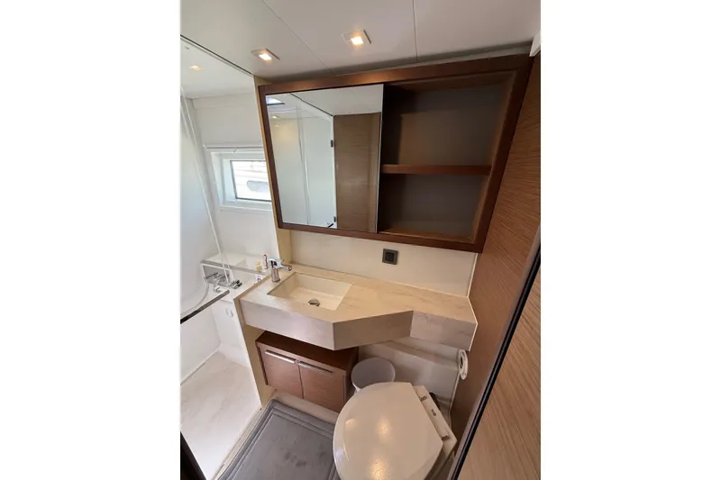 Slide: The Image of Modern bathroom in 2021 Lagoon 46 yacht, featuring sleek sink, mirror, and storage. - 79