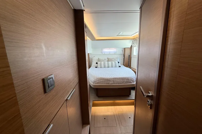 Slide: The Image of Luxurious bedroom interior of 2021 Lagoon 46 yacht with modern wood finish. - 82