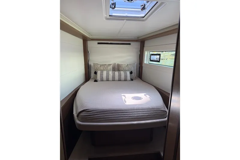 Slide: The Image of Luxurious cabin interior of 2021 Lagoon 46 yacht with cozy bed and modern decor. - 60