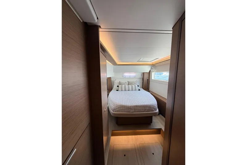 Slide: The Image of Luxurious cabin interior of 2021 Lagoon 46 yacht with modern design and cozy bedding. - 83