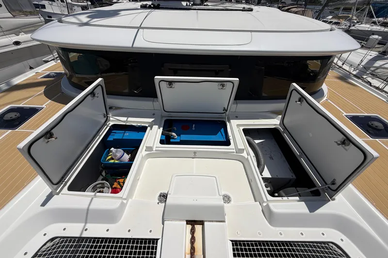Slide: The Image of Open storage compartments on a 2021 Lagoon 46 catamaran deck. - 25