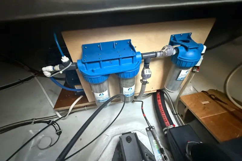 Slide: The Image of Water filtration system in a 2021 Lagoon 46 yacht engine room. - 92