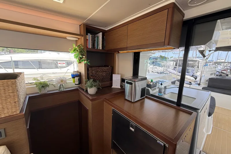Slide: The Image of Modern interior of 2021 Lagoon 46 yacht with kitchen and marina view. - 45