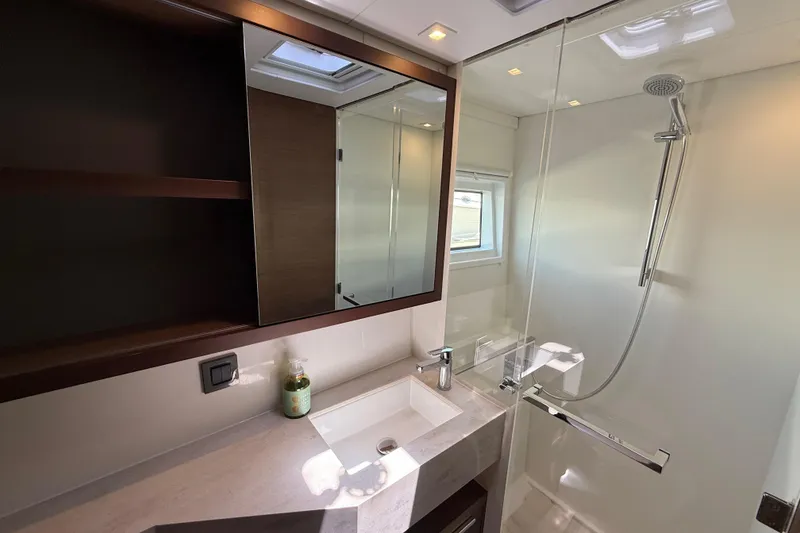 Slide: The Image of Modern bathroom in 2021 Lagoon 46 yacht with glass shower and sleek vanity. - 63