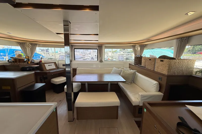 Slide: The Image of Interior of 2021 Lagoon 46 catamaran with modern seating and dining area. - 39
