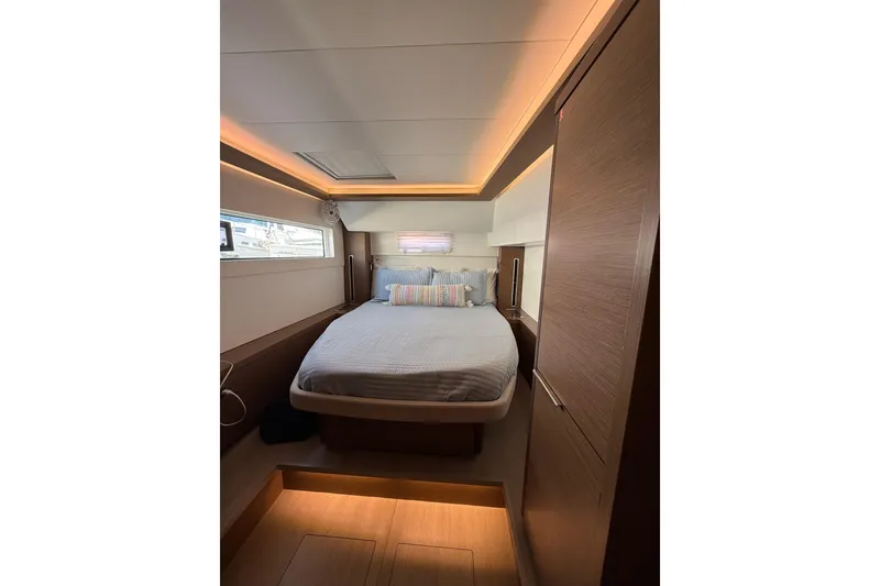 Slide: The Image of Luxurious bedroom interior of 2021 Lagoon 46 yacht with modern lighting and cozy bedding. - 72