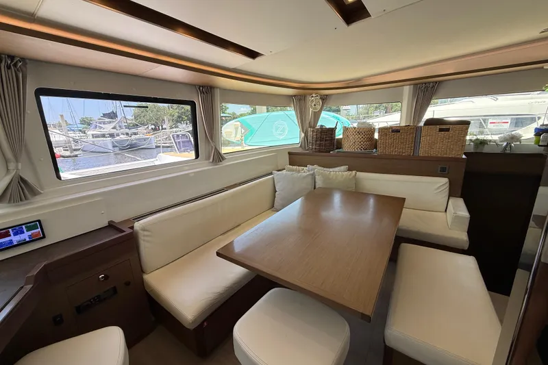 Slide: The Image of Interior of a 2021 Lagoon 46 yacht with elegant seating and large windows. - 44