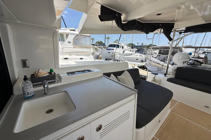 Slide: The Image of Interior view of a 2021 Lagoon 46 yacht with seating and sink area. - 34