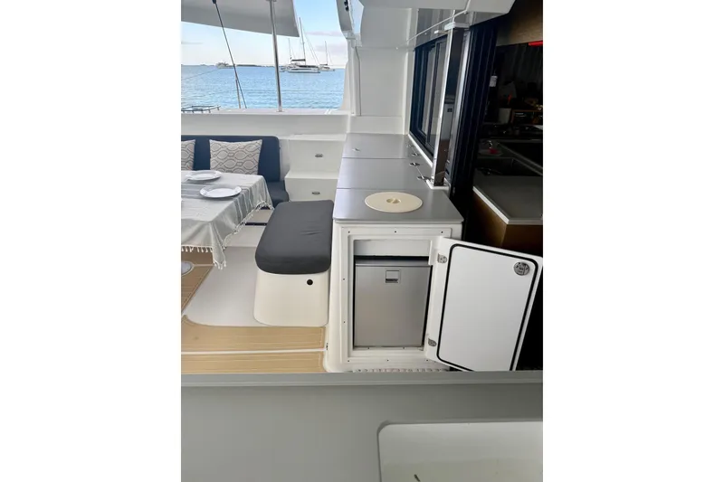 Slide: The Image of Outdoor dining area on a 2021 Lagoon 46 catamaran with ocean view. - 36