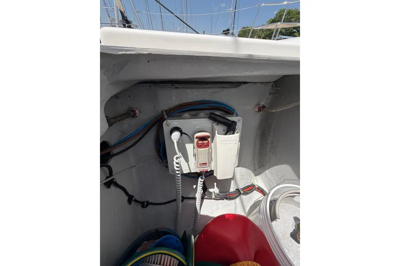 Slide: The Image of Electrical panel in a 2021 Lagoon 46 yacht, featuring wiring and controls. - 99