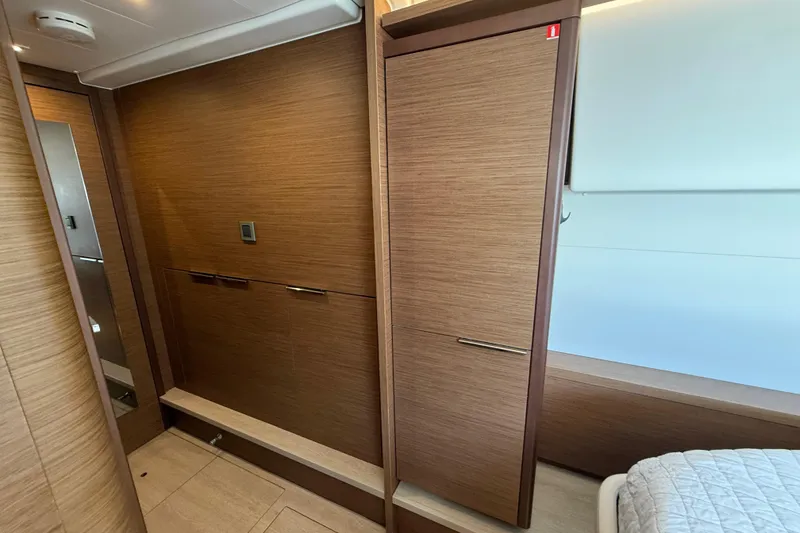 Slide: The Image of Interior of 2021 Lagoon 46 yacht with wood paneling and modern design. - 86