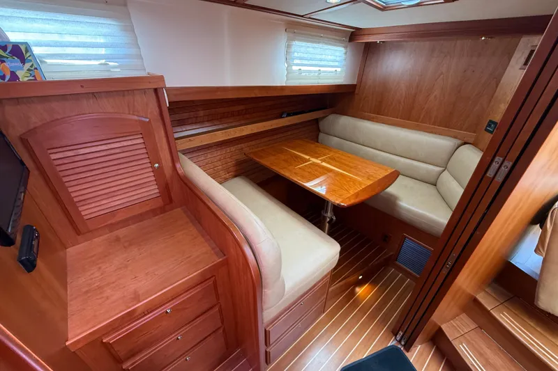 Slide: The Image of Luxurious interior of 2013 Sabre 42 Salon Express yacht with wooden furnishings and cozy seating. - 64