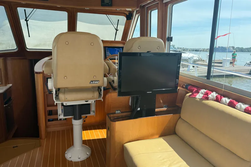 Slide: The Image of Interior of 2013 Sabre 42 Salon Express yacht with helm chairs and TV. - 38