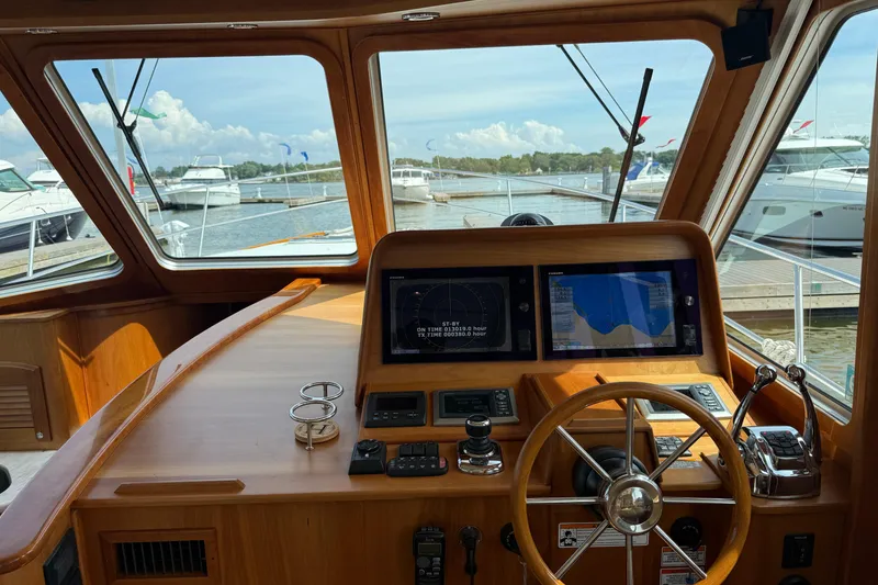 Slide: The Image of Interior view of 2013 Sabre 42 Salon Express yacht helm with navigation screens. - 42